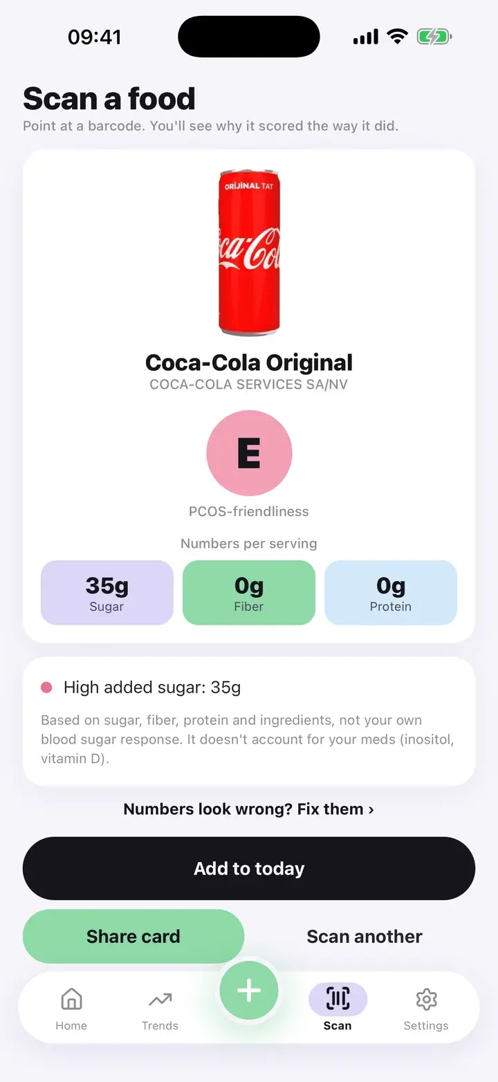 Scan result for a cola showing grade E, sugar, fiber and protein and the reason High added sugar (real product data from Open Food Facts)