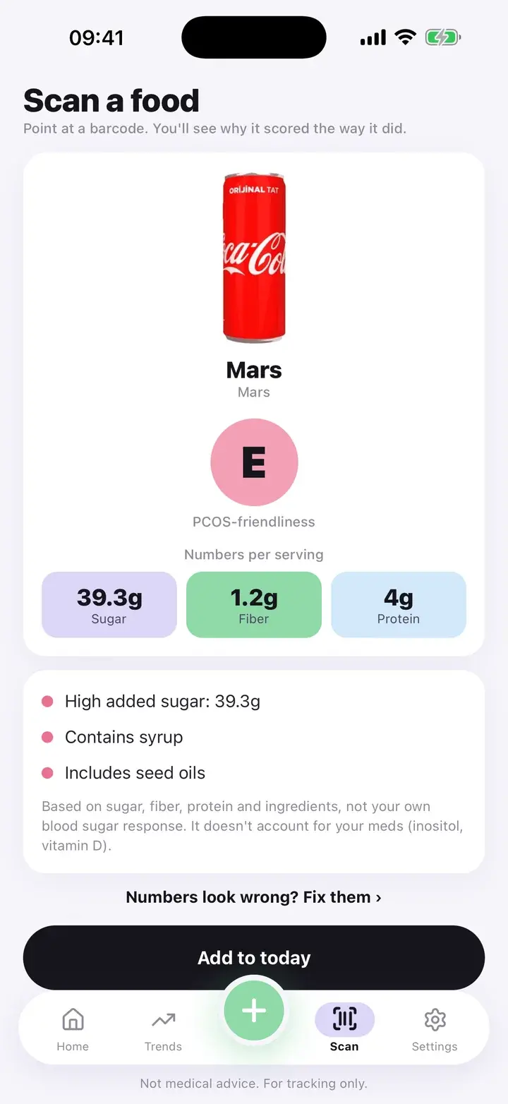Scan result for a chocolate bar showing grade E with three reasons: high added sugar, contains syrup and includes seed oils (real product data from Open Food Facts)